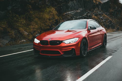 Red Car on the Wet Road