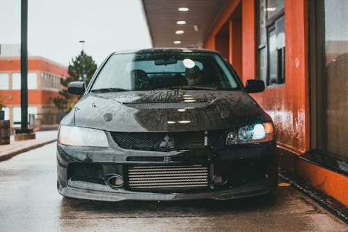 Black Car Parked Beside the Building