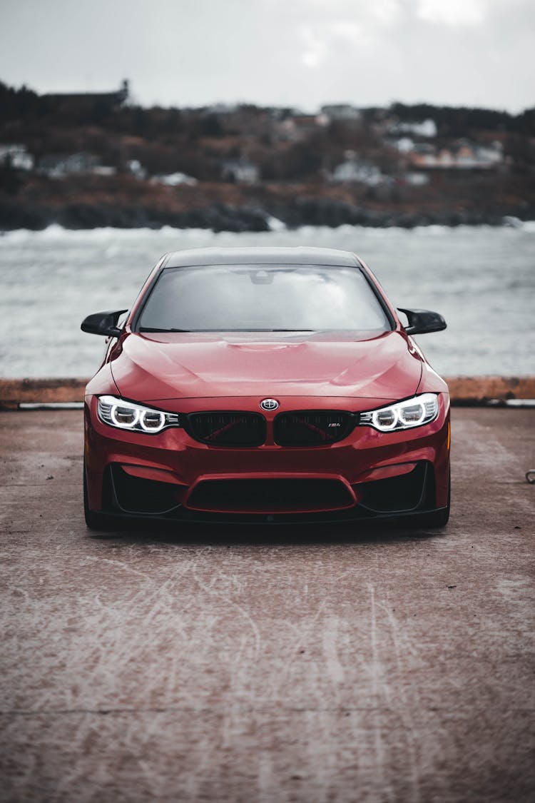 A Front View Of An Exterior Of A Red Car 