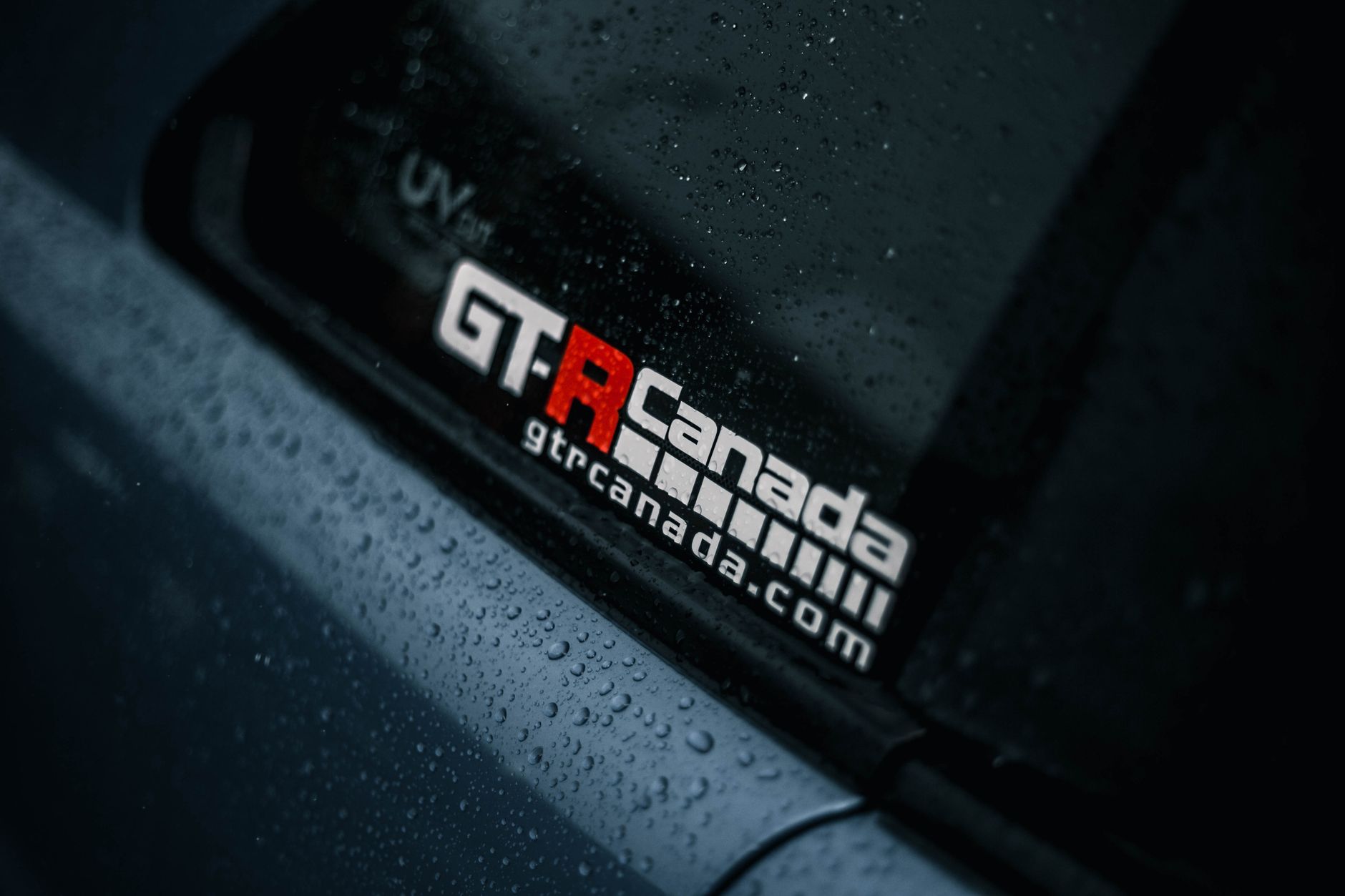 Close-up image showing raindrops on a car window with GTR Canada logo.