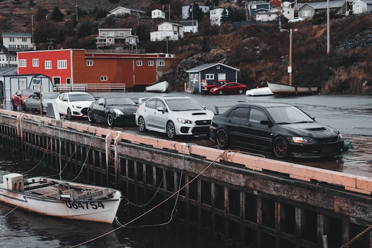 Cars Parked By A Sea