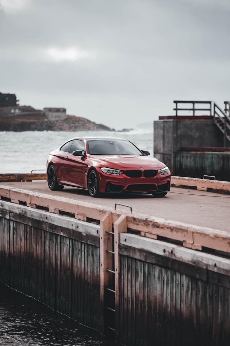 A Red Car Parked In Dock 