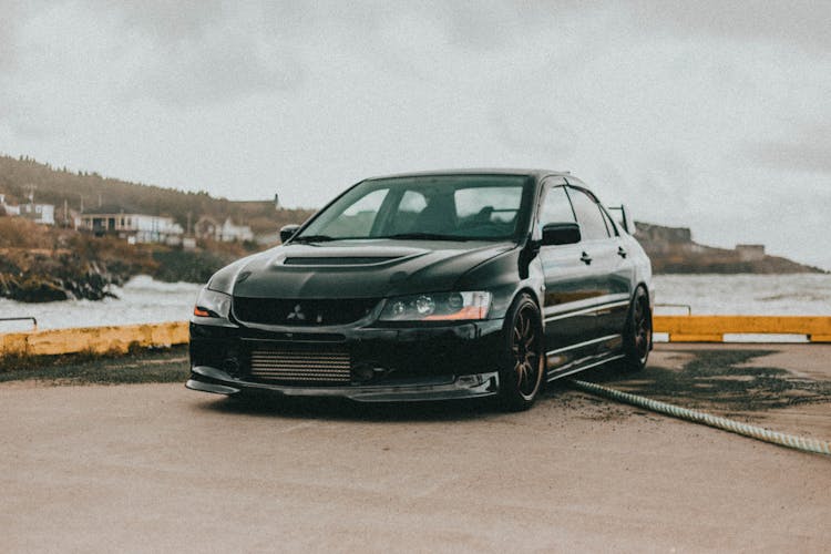 A Car Parked By The Sea