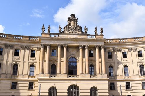 Free Facade of Humboldt University in Berlin showcasing neoclassical architecture and sculptures. Stock Photo