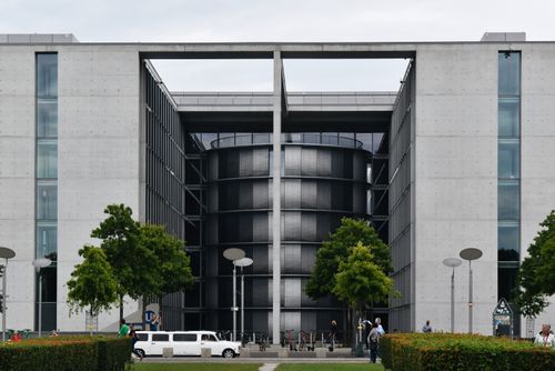 Free Contemporary architecture of a urban building facade with street and greenery in Berlin, Germany. Stock Photo