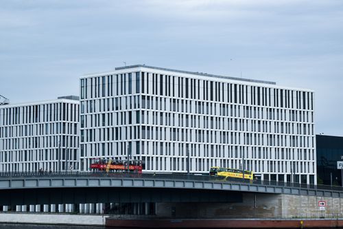 Free A contemporary office building with glass facade in Berlin, Germany, showcasing modern architecture. Stock Photo