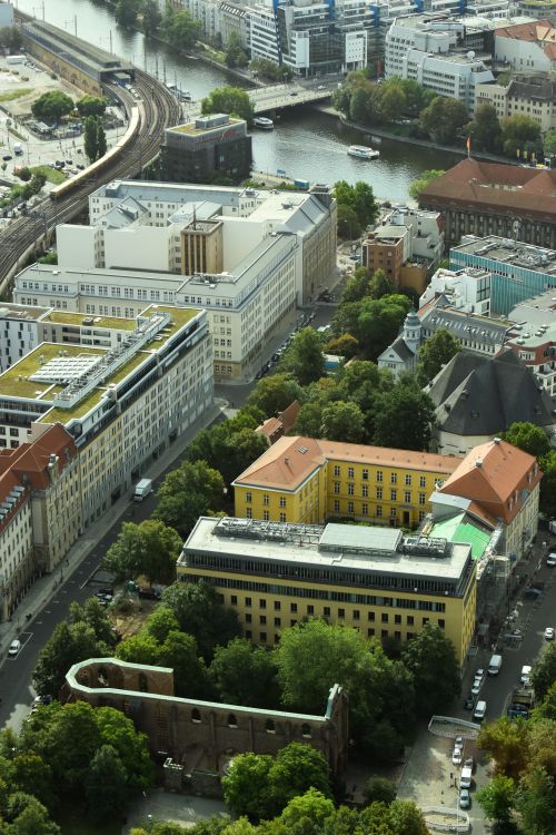 Free Aerial shot of Berlin's historic buildings and waterways showcasing urban architecture and green spaces. Stock Photo