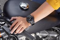 Person Wearing Black and Silver Round Analog Watch