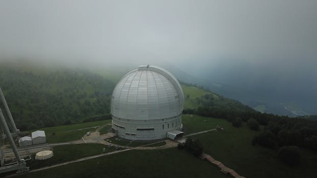 Aerial view of BTA-6 observatory amidst fog, located in Zelenchuksky District, Russia.