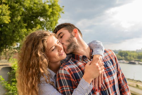 Free Man Kissing Woman Stock Photo