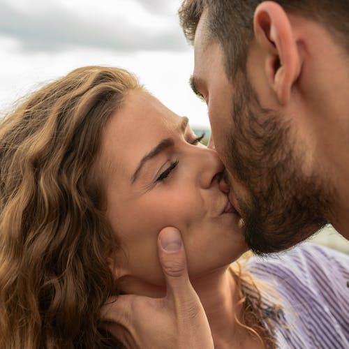 Man and Woman Kiss Each Other
