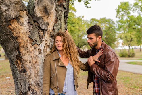 Free Man And Woman Wearing Brown Full-zip Jackets Stock Photo