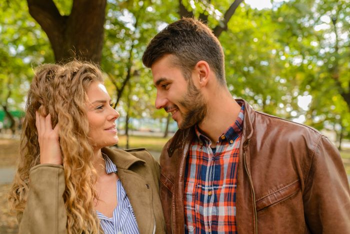 Happy couple smiling together outdoors after meeting on a free dating site in Australia