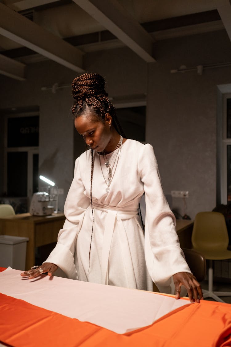 Portrait Of Fashion Designer Looking At Fabrics