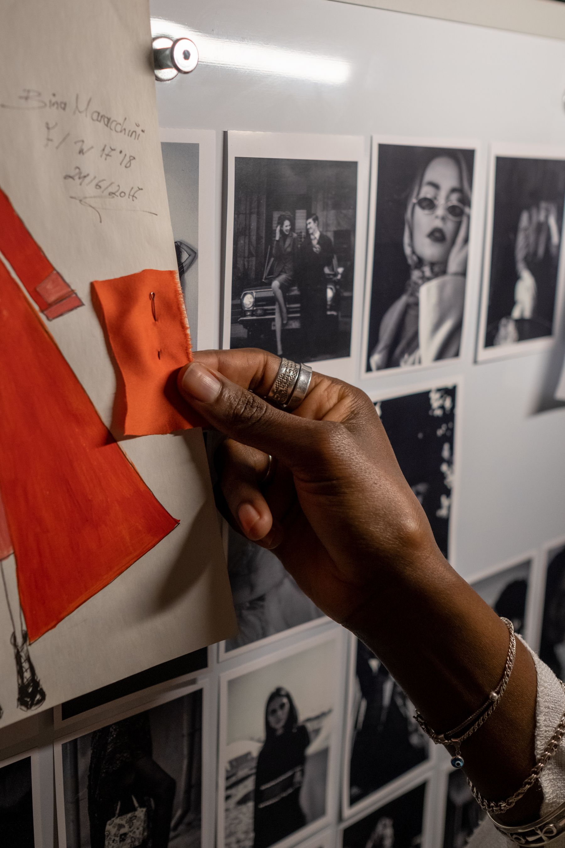 A project board being reviewed by hand