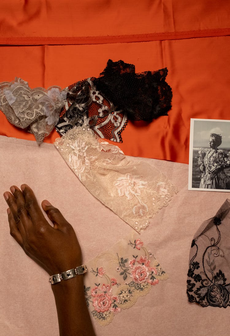 Womans Hand, Fabric Scraps And Photo