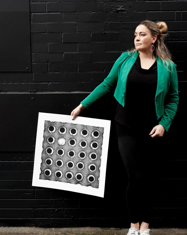 A Woman Holding A Poster