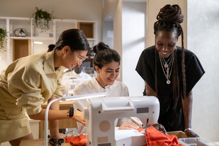 Group Of Fashion Designers Laughing