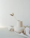 White Pillar Candle on White Textile