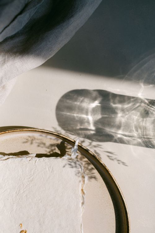 Free Elegant minimalistic composition with a plate and light reflections creating shadows. Stock Photo