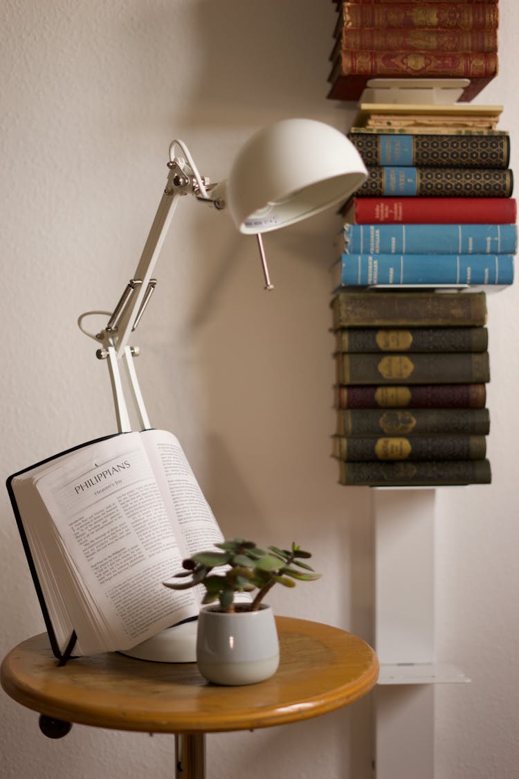 A Bible On Route Table Under A Lamp Shade