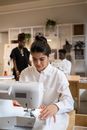 Woman in White Dress Shirt Sewing