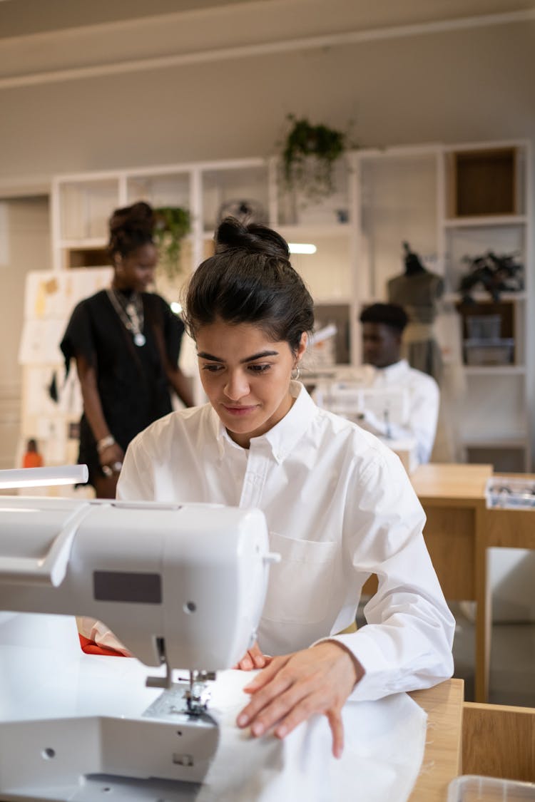 Woman In White Dress Shirt Sewing