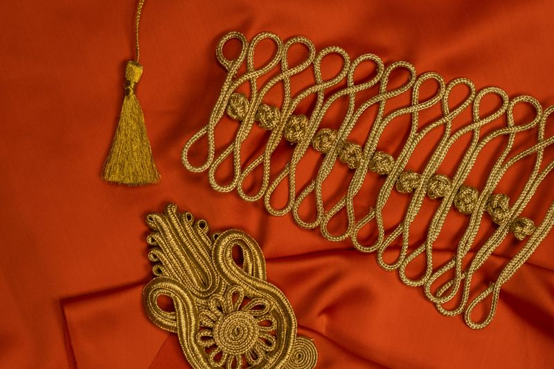 Close-up of gold embroidery detail on fabric