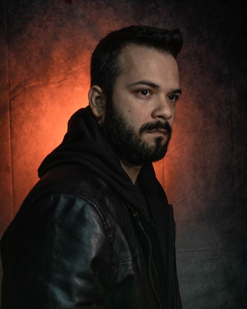 Free Studio portrait of a man in a leather jacket with dramatic lighting in Dublin. Stock Photo