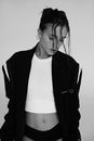 Black and White Photo of Woman in Jacket, Shorts and Tank Top