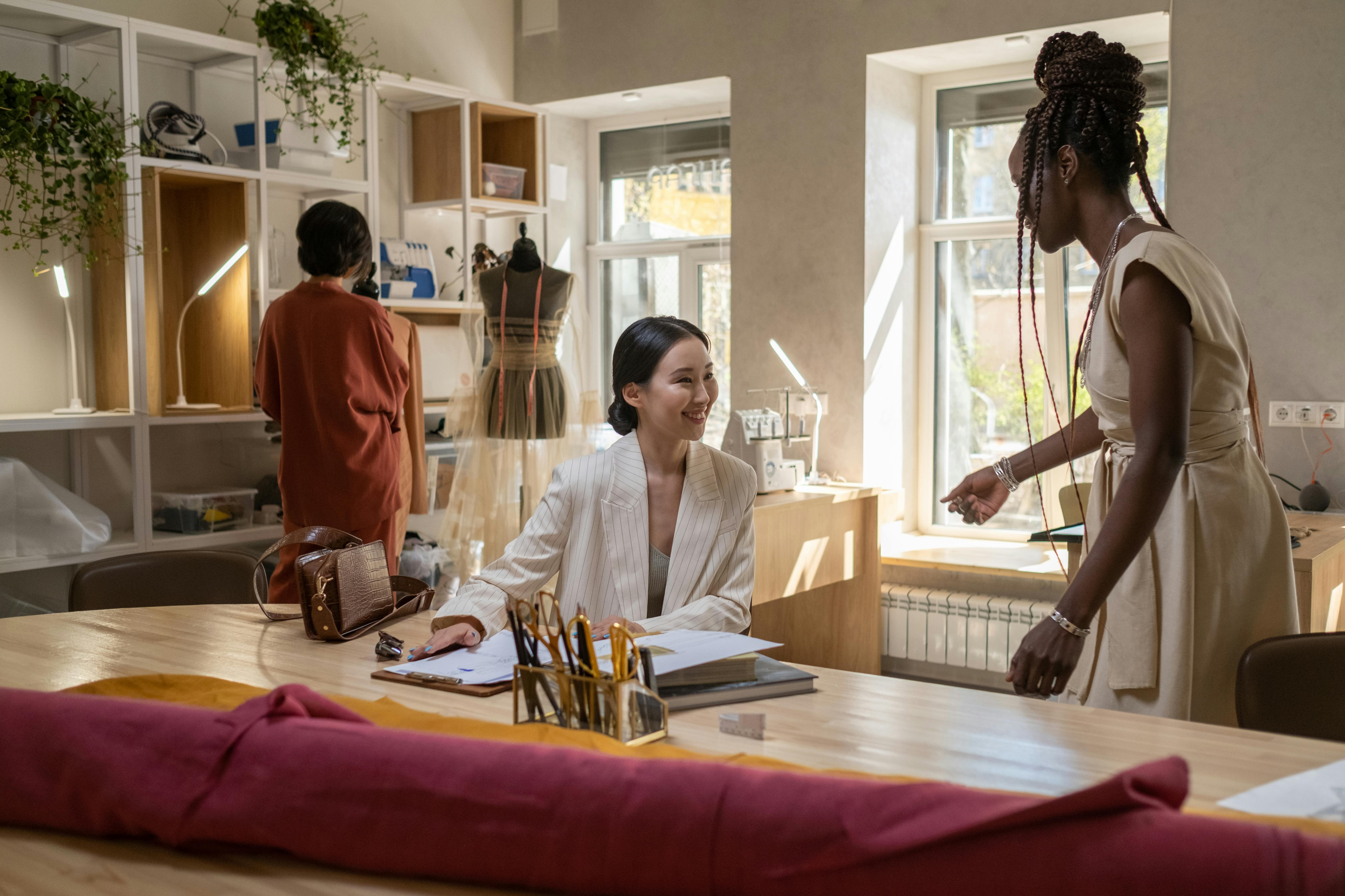 women smiling to each other in room