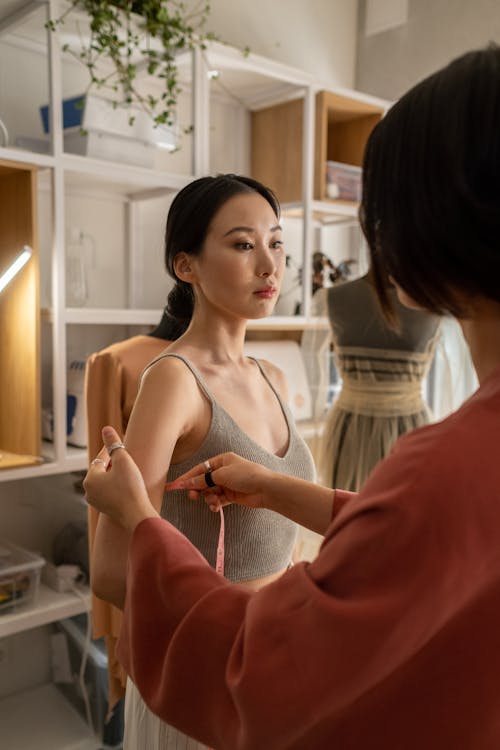 Woman Being Measure by Tailor