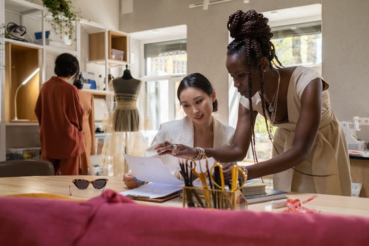 Women Designing Clothes In Studio 