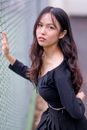 Woman in Black Long Sleeve Shirt Holding White Net
