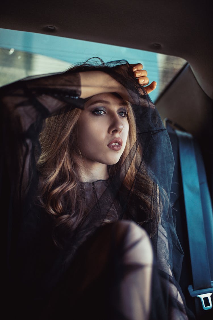 A Woman Sitting In The Car