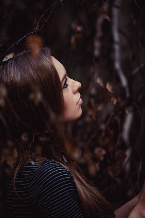 Woman in Striped Shirt Looking Up