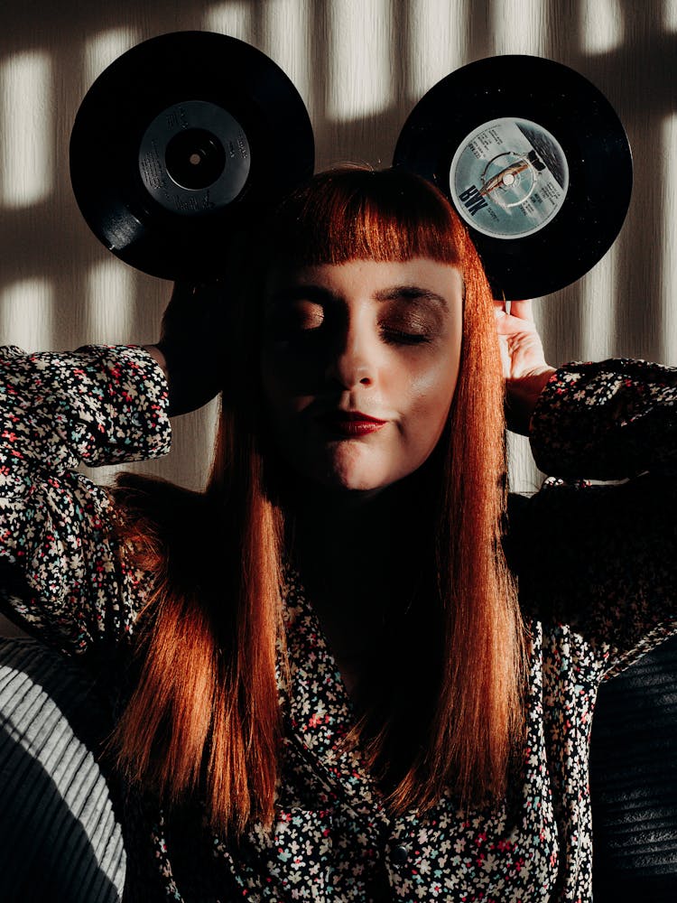 Red Hair Woman With Closed Eyes Holding Vinyl Records As Mouse Ears