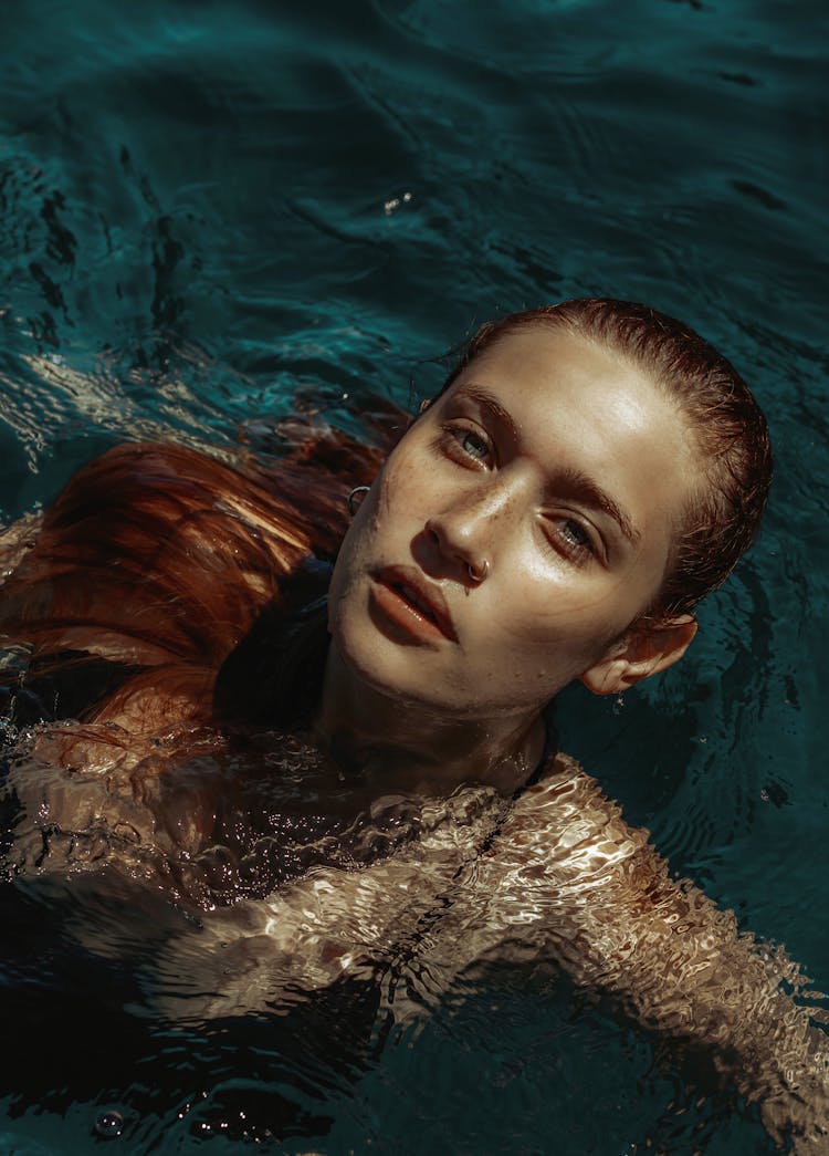 Girl With Ginger Hair In The Water