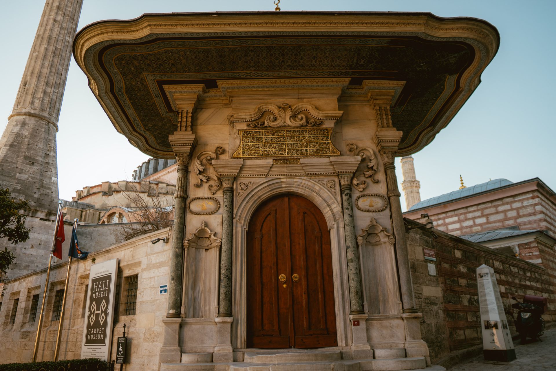 Explore the intricate architecture of the Carpet Museum entrance in Istanbul's rich historical setting.