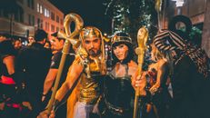 People Wearing Gold and Black Masks