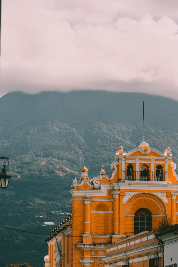 Orange Concrete Building Near The Mountain