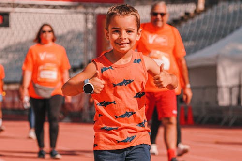 Free A Boy in Orange Tank Top Stock Photo