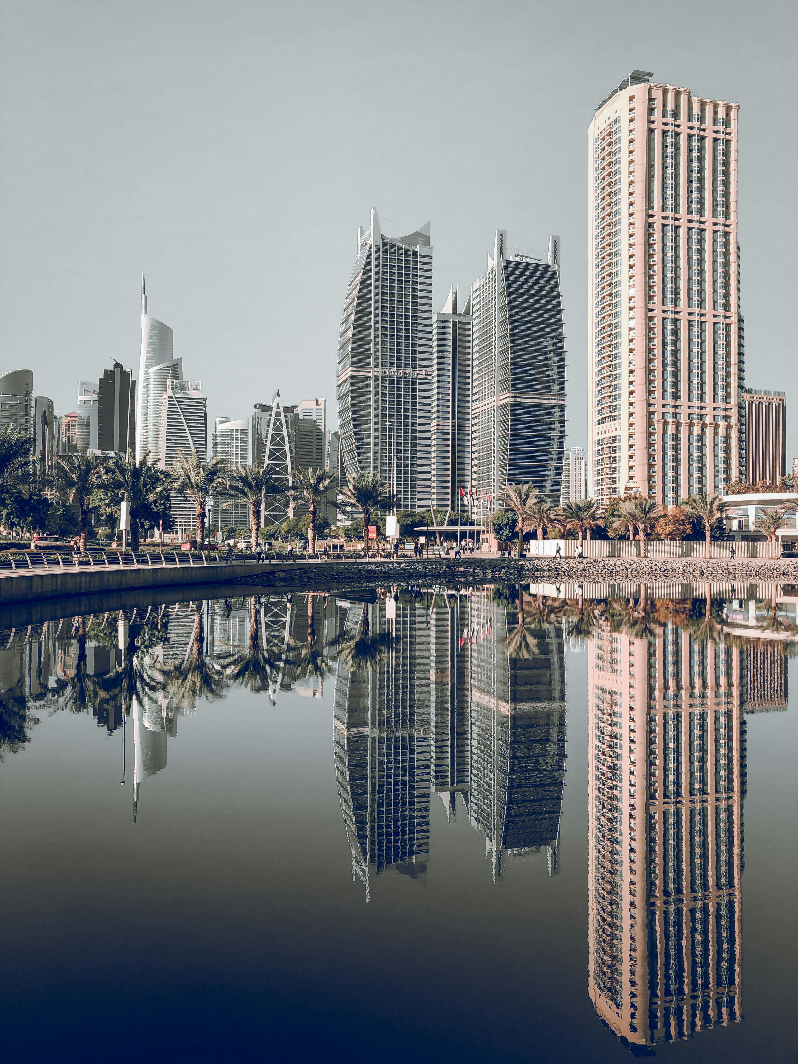 Gray High-rise Building Under Blue and White Sky · Free Stock Photo