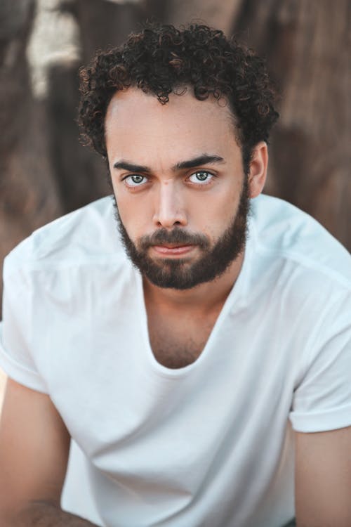 Portrait of Black Hair Man in White T-Shirt