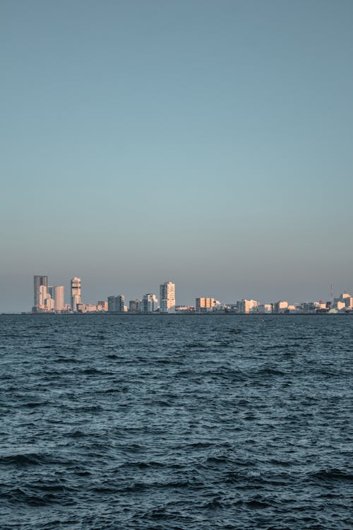 City Skyline Across Body of Water