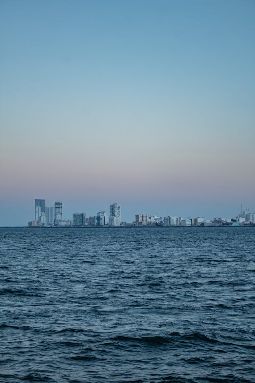 City Skyline Across Body of Water