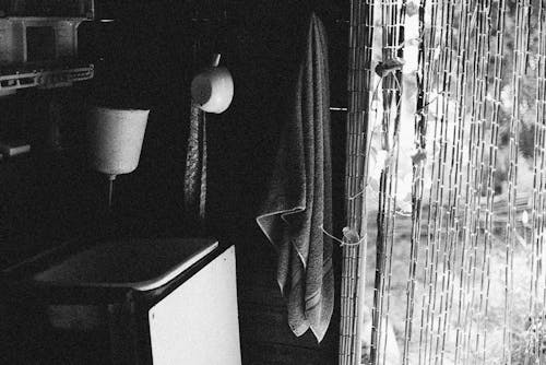 Grayscale Photo of Kitchen Curtain