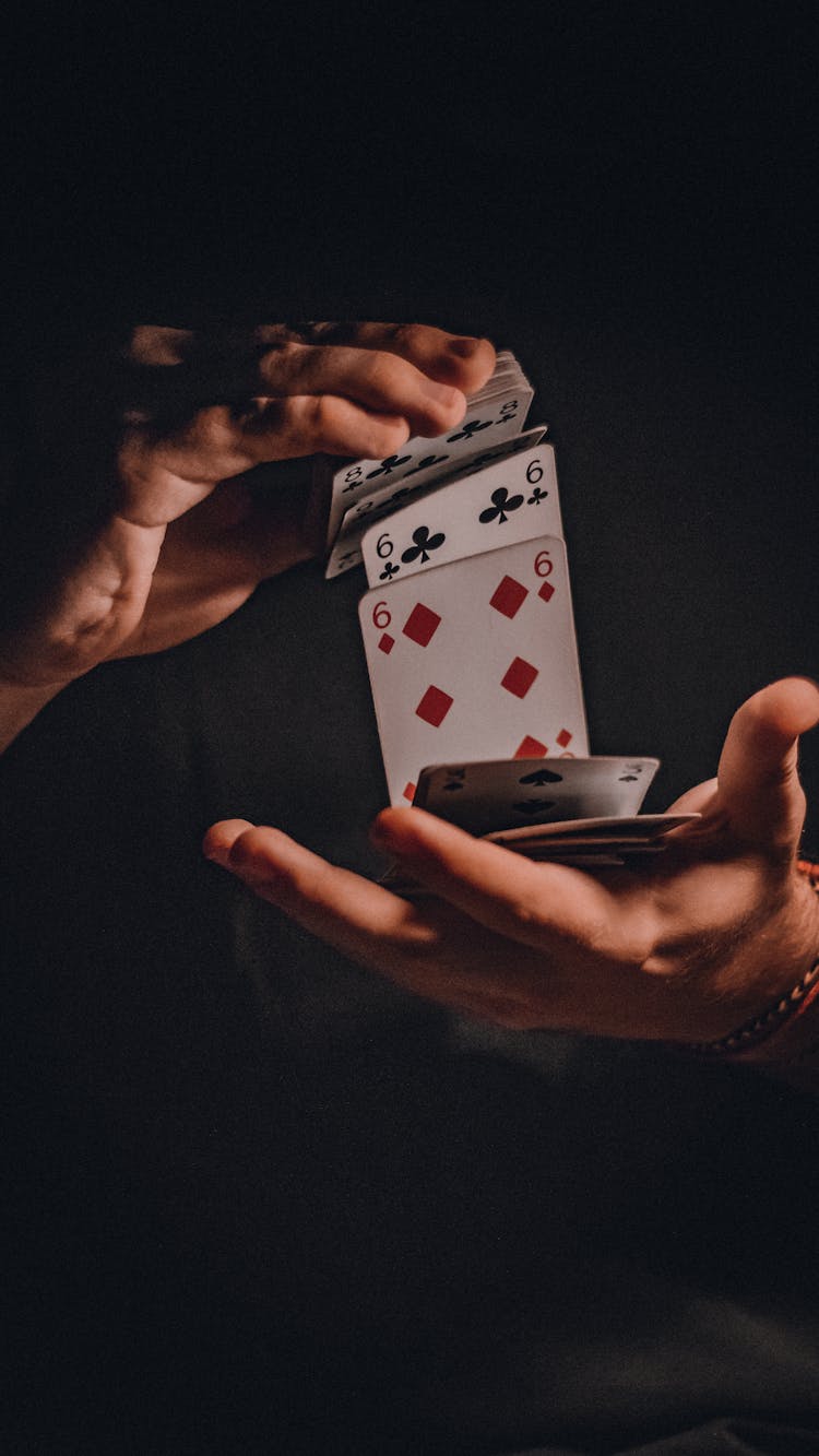 A Person Shuffling Cards 