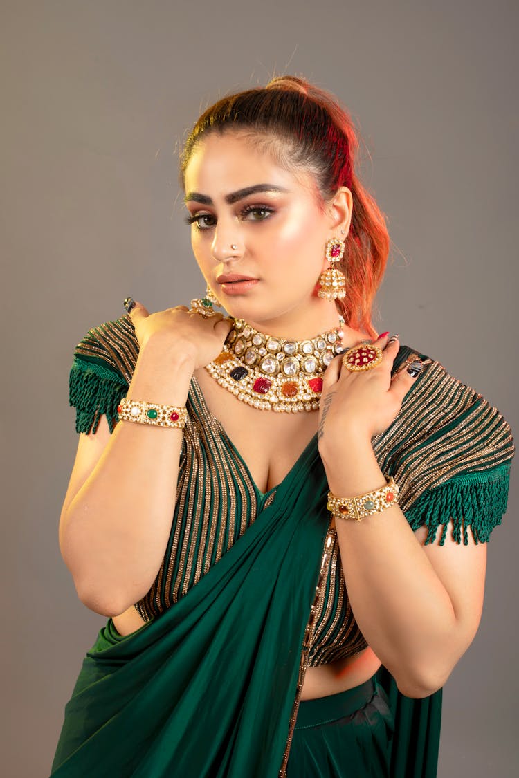 Woman In Traditional Dress On Studio Background