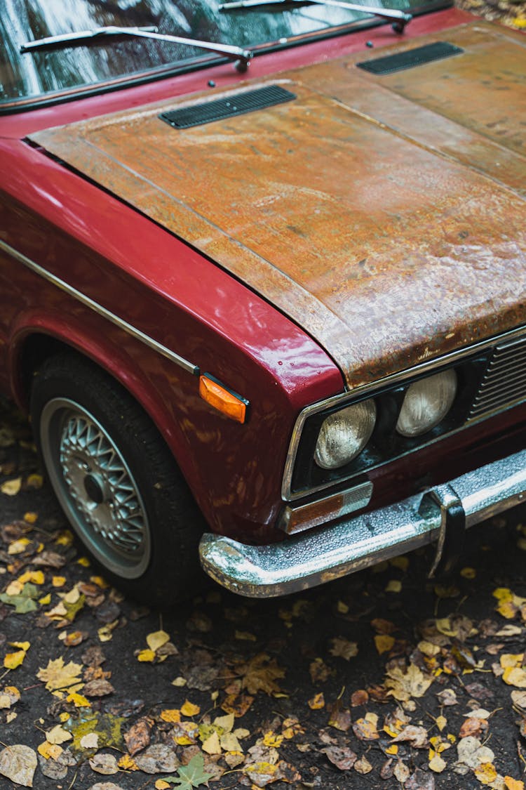 Red Car With A Rusty Hood